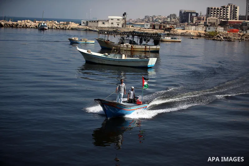 Palestinians show their solidarity with a Gaza-bound flotilla of international activists attempting to break the Israeli blockade on the Hamas-run Gaza Strip, on October 5, 2016 at the port in Gaza City. A group of women...