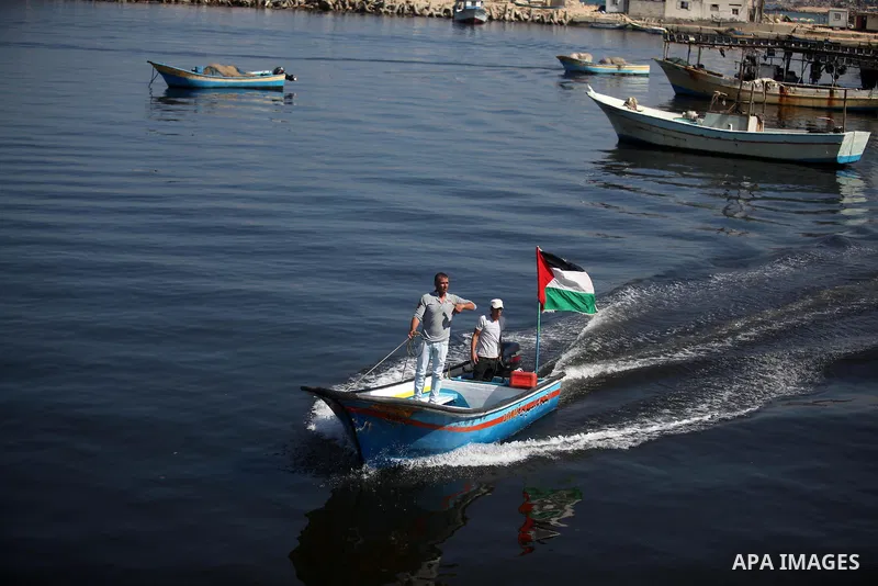 Palestinians show their solidarity with a Gaza-bound flotilla of international activists attempting to break the Israeli blockade on the Hamas-run Gaza Strip, on October 5, 2016 at the port in Gaza City. A group of women...