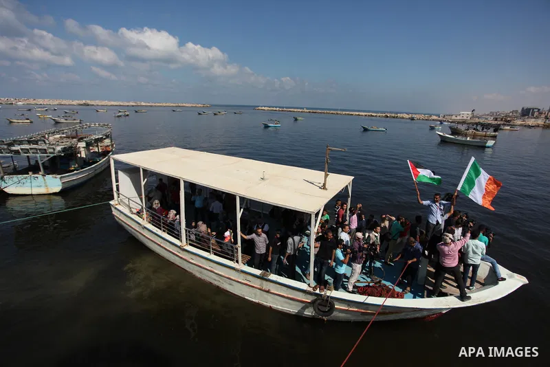 Palestinians show their solidarity with a Gaza-bound flotilla of international activists attempting to break the Israeli blockade on the Hamas-run Gaza Strip, on October 5, 2016 at the port in Gaza City. A group of women...