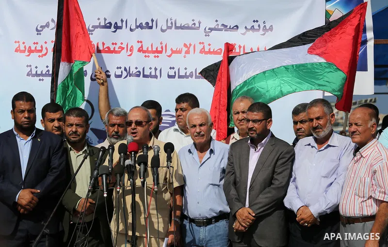 Deputy Speaker of the Legislative Council, Faisal Abu Shahla speaks during a press conference in the port of Gaza city, on October 6, 2016. Photo by Mohammed Asad