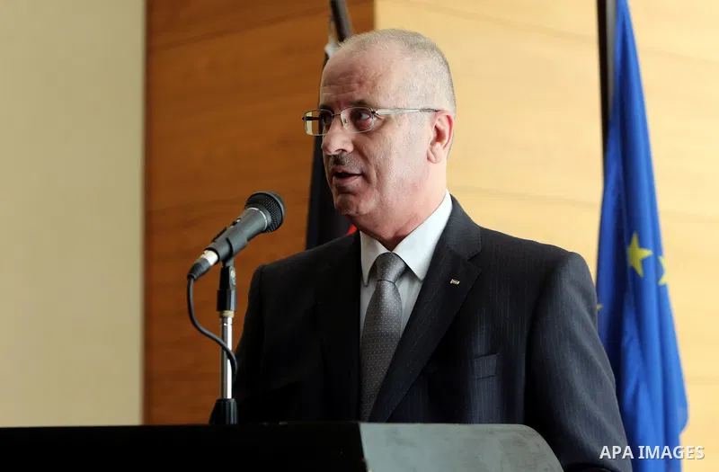 Palestinian Prime Minister Rami Hamdallah speaks during celebrations for German Unity Day, in the West Bank city of Ramallah, on October 06, 2016. Photo by Prime Minister Office