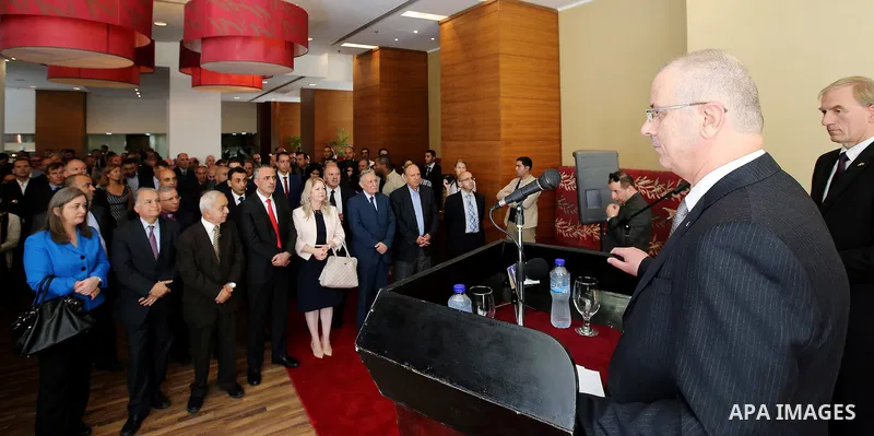 Palestinian Prime Minister Rami Hamdallah speaks during celebrations for German Unity Day, in the West Bank city of Ramallah, on October 06, 2016. Photo by Prime Minister Office