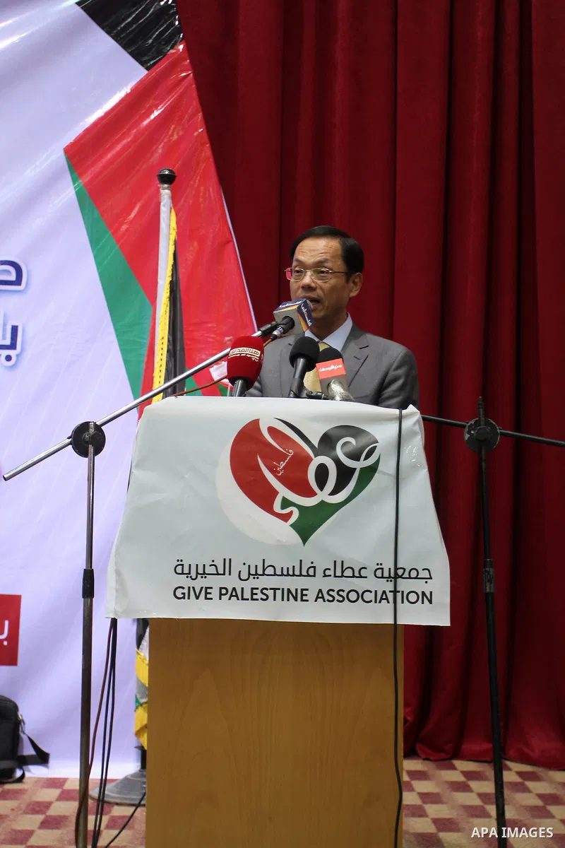 Chinese Ambassador to Palestine, Chen Zhong Xing speaks during a ceremony of opening the project of Lighting solar homes, in Khan Younis in the southern Gaza strip, on Oct. 06, 2016. Photo by Abed Rahim Khatib