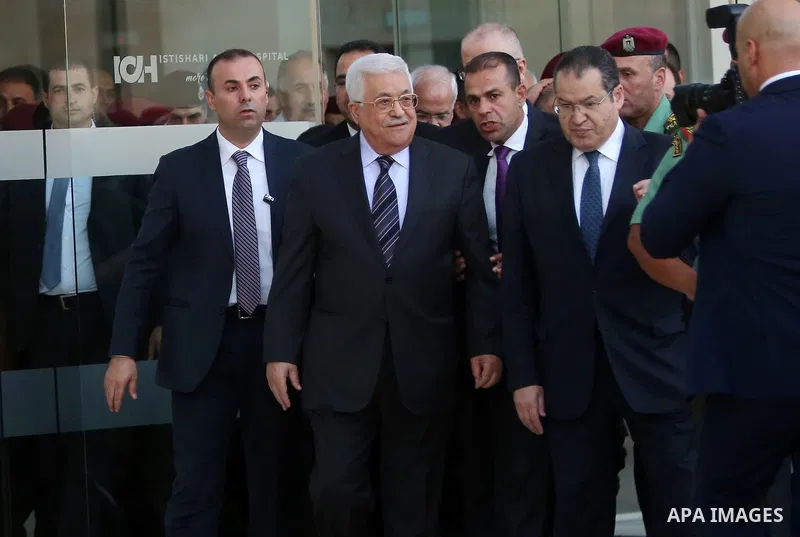 Palestinian President Mahmoud Abbas leaves the hospital in the West Bank city of Ramallah, October 6, 2016. Photo by Shadi Hatem