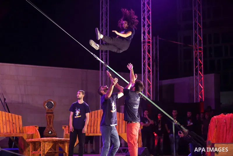 International and local artists, perform during the Palestine Circus Festival, in the West Bank city of Ramallah, on October 6, 2016. Photo by Shadi Hatem