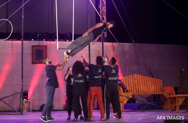 International and local artists, perform during the Palestine Circus Festival, in the West Bank city of Ramallah, on October 6, 2016. Photo by Shadi Hatem