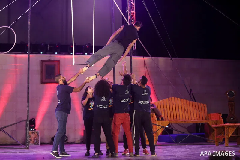 International and local artists, perform during the Palestine Circus Festival, in the West Bank city of Ramallah, on October 6, 2016. Photo by Shadi Hatem