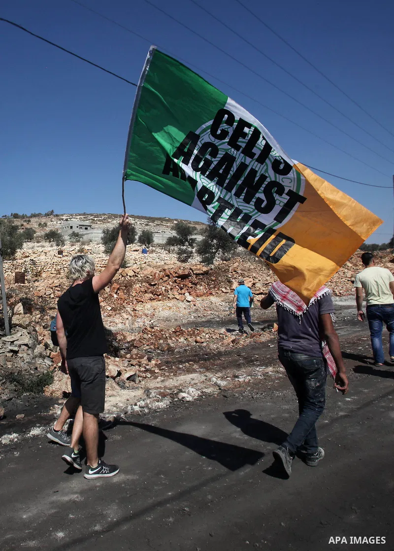Palestinian protesters and activity demonstrate against the expropriation of Palestinian land by Israel on October 6, 2016, in the village of Kfar Qaddum, near Nablus, in the occupied West Bank. Photo by Nedal Eshtayah