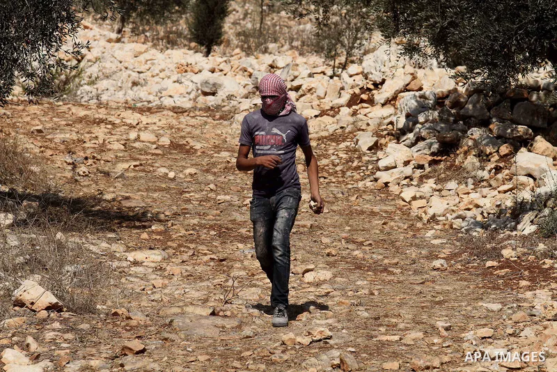 A Palestinian protester demonstrates against the expropriation of Palestinian land by Israel on October 6, 2016, in the village of Kfar Qaddum, near Nablus, in the occupied West Bank. Photo by Nedal Eshtayah