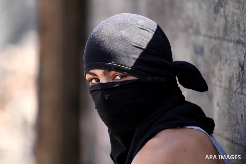 A Palestinian protester demonstrates against the expropriation of Palestinian land by Israel on October 6, 2016, in the village of Kfar Qaddum, near Nablus, in the occupied West Bank. Photo by Nedal Eshtayah