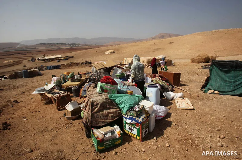 Palestinians inspect the remains of a house after it was demolished by Israeli authorities who said it was built without municipal permission on October 9, 2016 in the West Bank village of Khirbet ar-Ras al-Ahmar, north...