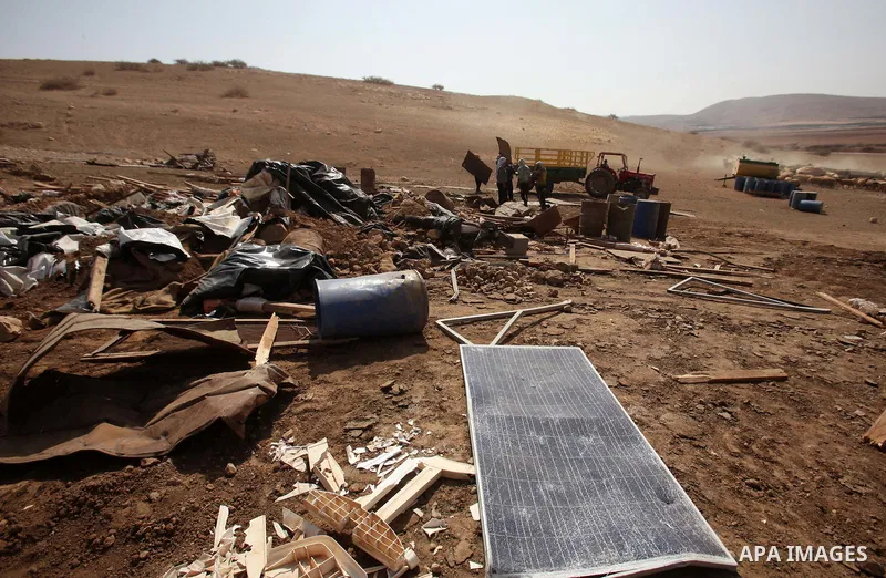 Palestinians inspect the remains of a house after it was demolished by Israeli authorities who said it was built without municipal permission on October 9, 2016 in the West Bank village of Khirbet ar-Ras al-Ahmar, north...