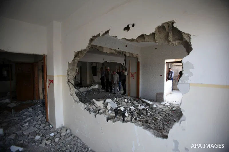 Palestinians check the house of Amjad Aliwi, a man accused of taking part in the killing of a Jewish settler couple near the settlement of Itamar in October last year, after Israeli authorities demolished it on October 1...