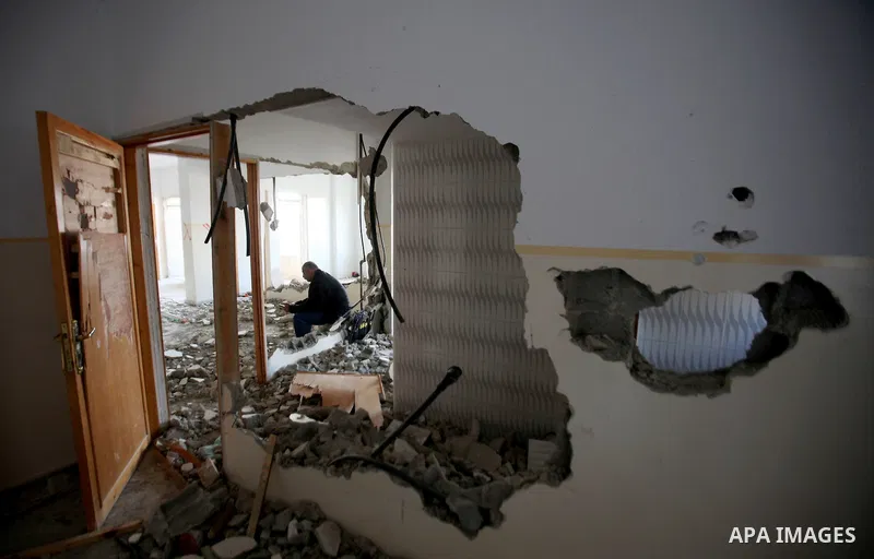 Palestinians check the house of Amjad Aliwi, a man accused of taking part in the killing of a Jewish settler couple near the settlement of Itamar in October last year, after Israeli authorities demolished it on October 1...