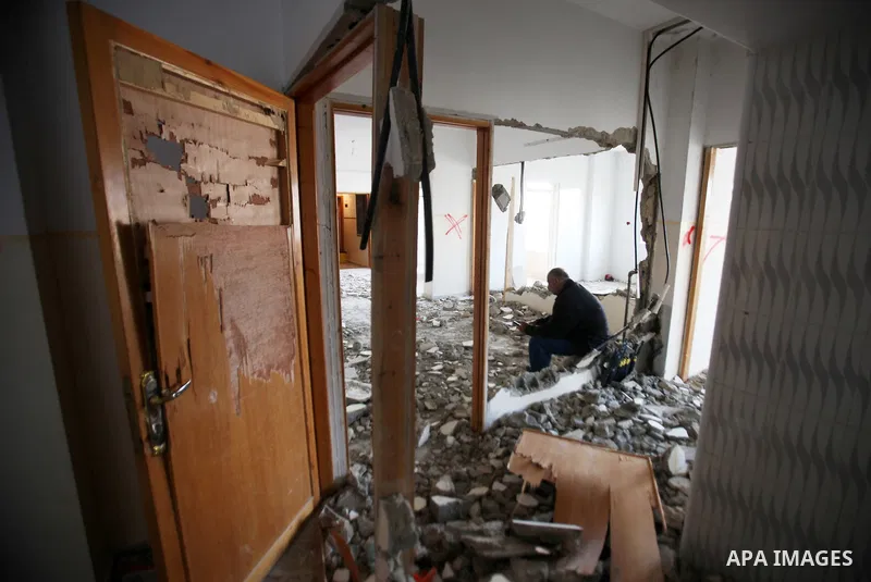 Palestinians check the house of Amjad Aliwi, a man accused of taking part in the killing of a Jewish settler couple near the settlement of Itamar in October last year, after Israeli authorities demolished it on October 1...