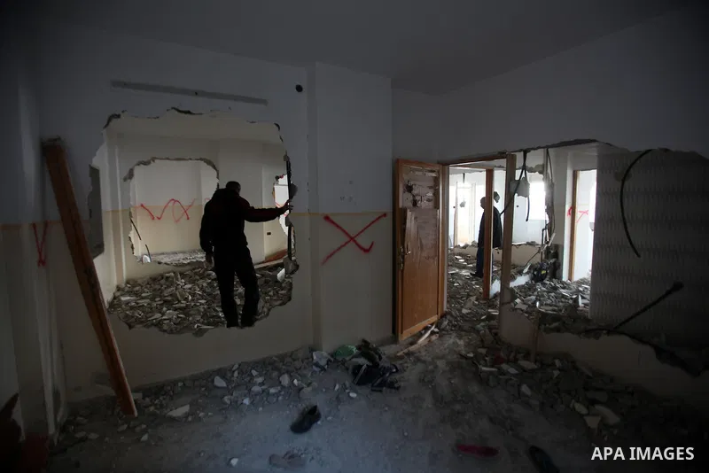 Palestinians check the house of Amjad Aliwi, a man accused of taking part in the killing of a Jewish settler couple near the settlement of Itamar in October last year, after Israeli authorities demolished it on October 1...
