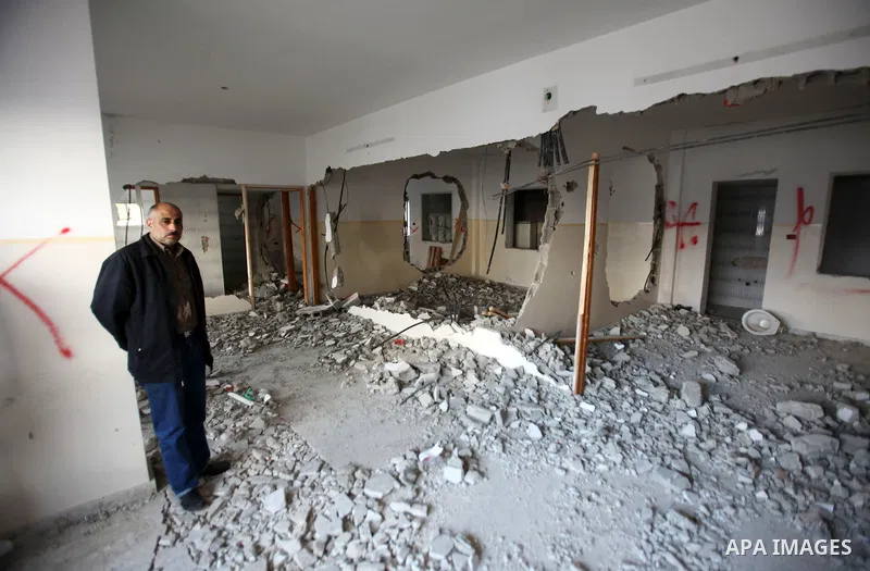 Palestinians check the house of Amjad Aliwi, a man accused of taking part in the killing of a Jewish settler couple near the settlement of Itamar in October last year, after Israeli authorities demolished it on October 1...