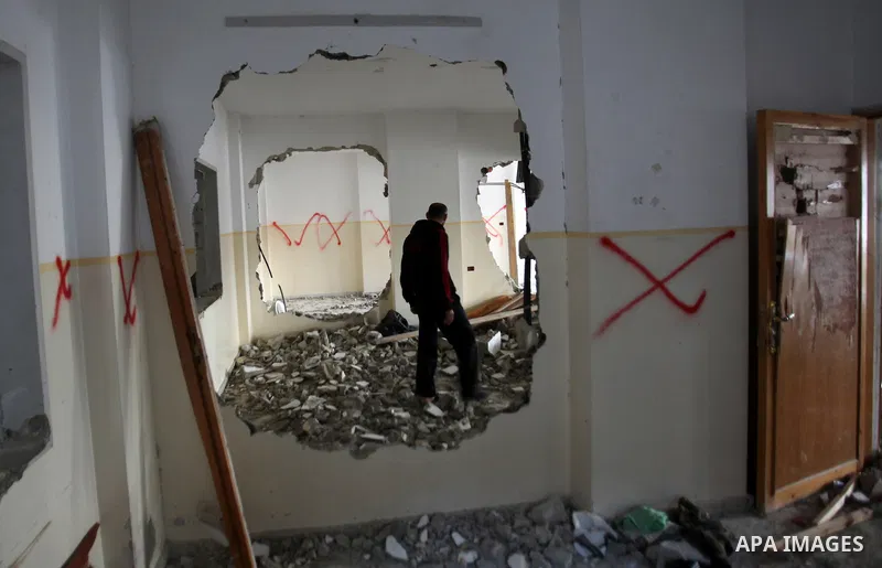 Palestinians check the house of Amjad Aliwi, a man accused of taking part in the killing of a Jewish settler couple near the settlement of Itamar in October last year, after Israeli authorities demolished it on October 1...