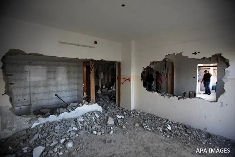 Palestinians check the house of Amjad Aliwi, a man accused of taking part in the killing of a Jewish settler couple near the settlement of Itamar in October last year, after Israeli authorities demolished it on October 1...