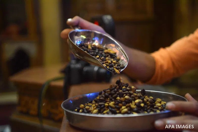 An Egyptian man makes a coffee at a factory, in Cairo, Egypt on October 11, 2016. The shop of Abdul Salam Al-banan is one of the oldest shops of the coffee industry in Egypt. Photo by Amr Sayed