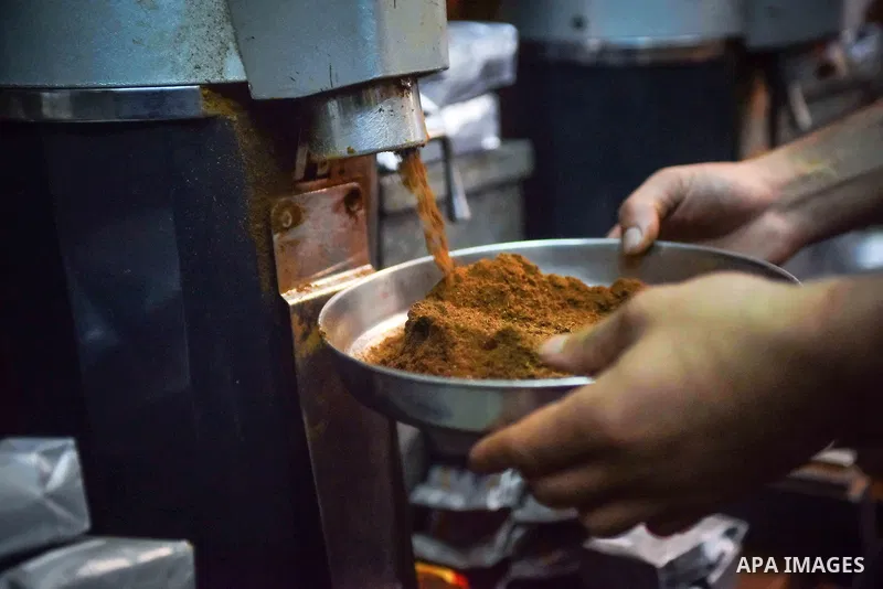An Egyptian man makes a coffee at a factory, in Cairo, Egypt on October 11, 2016. The shop of Abdul Salam Al-banan is one of the oldest shops of the coffee industry in Egypt. Photo by Amr Sayed
