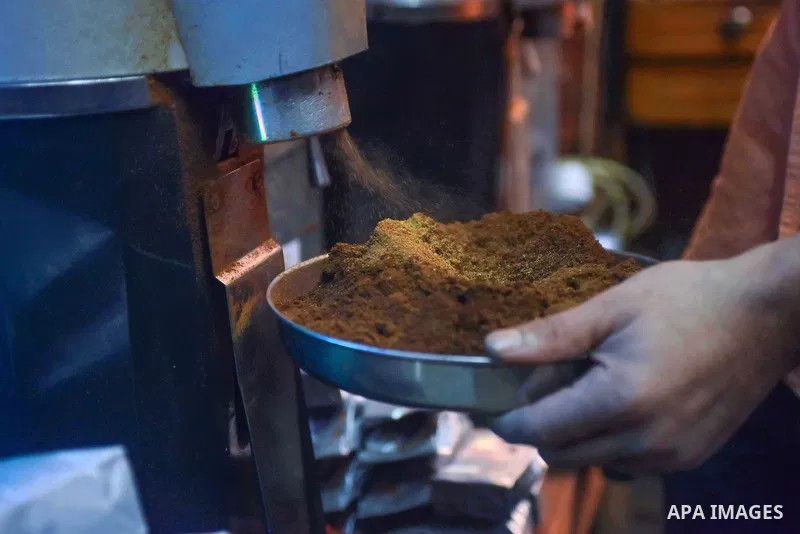An Egyptian man makes a coffee at a factory, in Cairo, Egypt on October 11, 2016. The shop of Abdul Salam Al-banan is one of the oldest shops of the coffee industry in Egypt. Photo by Amr Sayed
