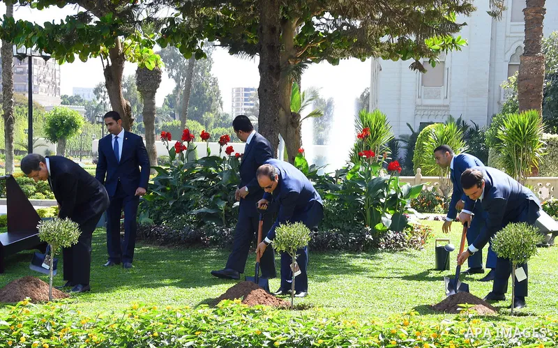 Egyptian President Abdel Fattah al-Sisi, Greek Prime Minister Alexis Tsipras and Greek Cyprian Leader Nicos Anastasiades, plant olive trees at Ittihadiya presidential palace garden in eastern Cairo, Egypt on October 11,...