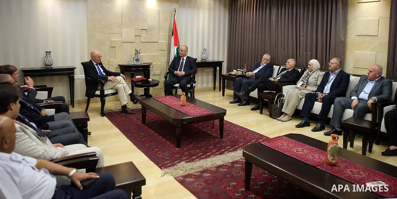 Palestinian Prime Minister Rami hamdallah meets with Secretary-General of the United Nations competent assistant sports affairs and development, Wilfried Lemke, in the West Bank city of Ramallah on October 12, 2016. Phot...