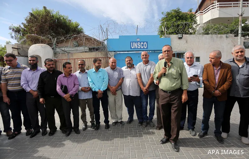 Palestinian members of the factions attend in a press conference, in front of the United Nations Special Coordinator (UNSCO) headquarters in Gaza city on October 12, 2016. Photo by Mohammed Asad