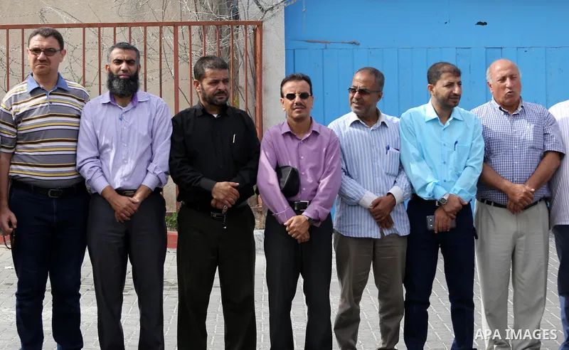 Palestinian members of the factions attend in a press conference, in front of the United Nations Special Coordinator (UNSCO) headquarters in Gaza city on October 12, 2016. Photo by Mohammed Asad
