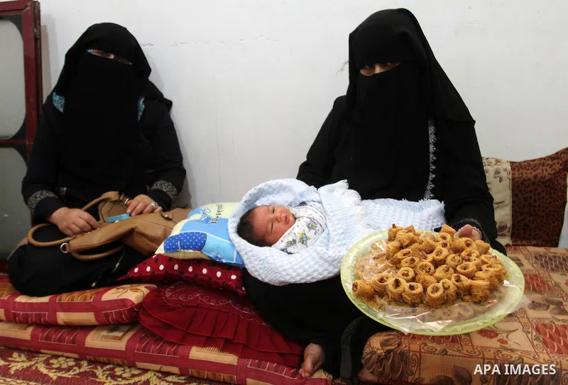 Tahany Shaath holds her three-day-old new-born son Waleed at their house in the southern Gaza Strip town of Rafah on October 12, 2016. The two millionth person has been born in Gaza, with the birth Waleed officially reco...