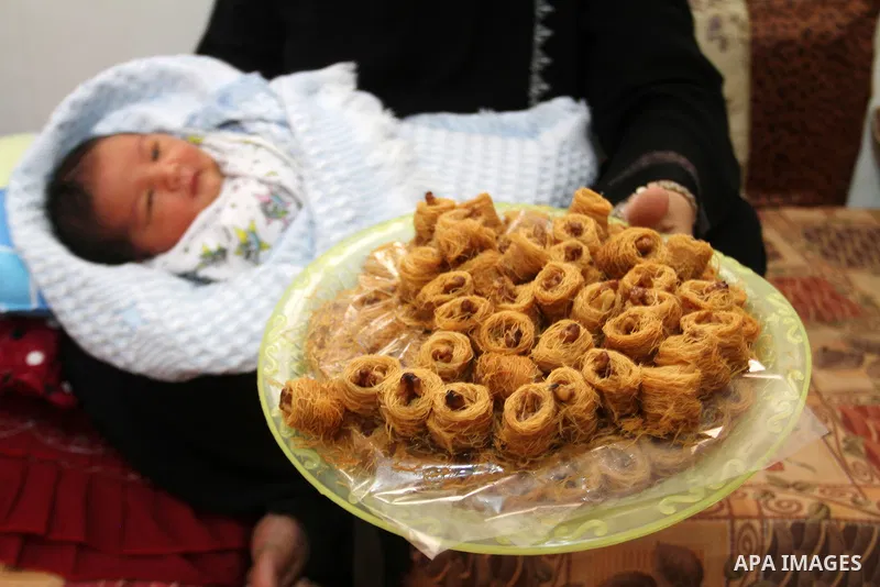 Tahany Shaath holds her three-day-old new-born son Waleed at their house in the southern Gaza Strip town of Rafah on October 12, 2016. The two millionth person has been born in Gaza, with the birth Waleed officially reco...