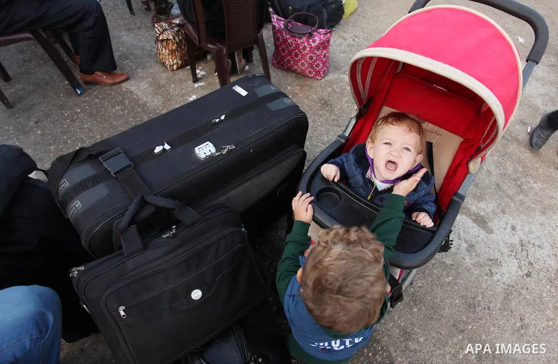 Palestinians wait for travel permits to cross into Egypt through the Rafah border crossing on October 15, 2016 in the southern Gaza Strip. Egyptian authorities temporarily reopened the crossing both directions for two da...