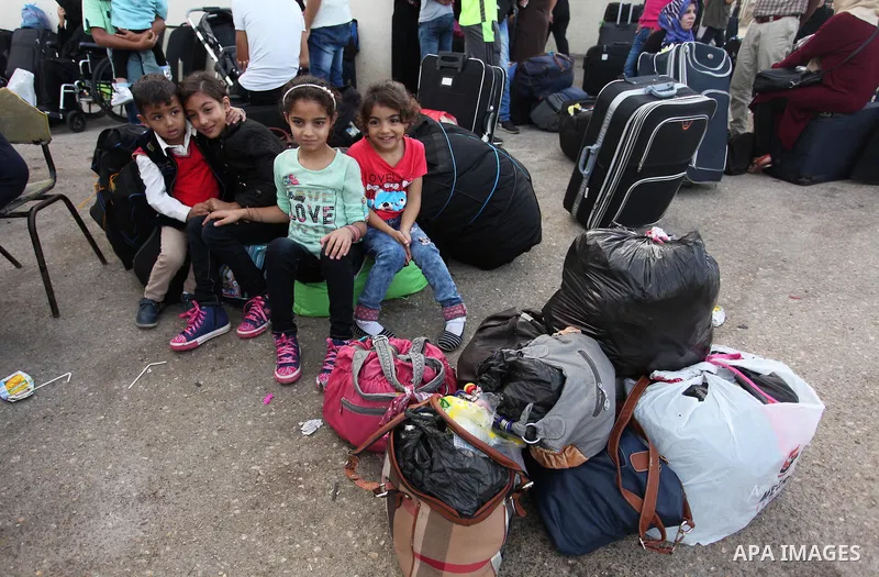 Palestinians wait for travel permits to cross into Egypt through the Rafah border crossing on October 15, 2016 in the southern Gaza Strip. Egyptian authorities temporarily reopened the crossing both directions for two da...