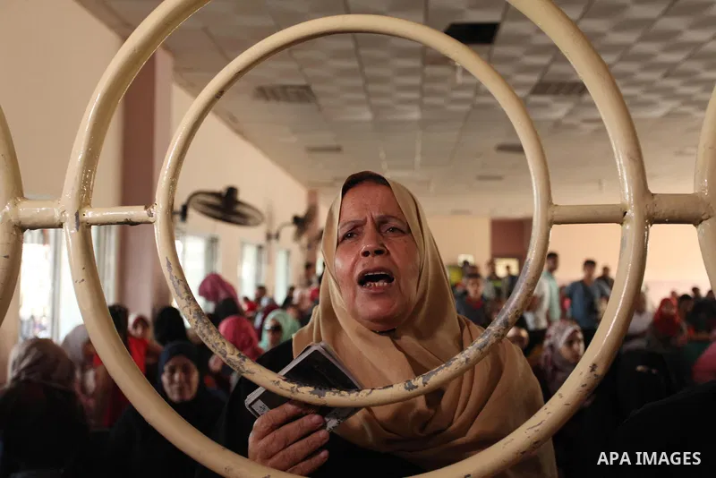 Palestinians wait for travel permits to cross into Egypt through the Rafah border crossing on October 15, 2016 in the southern Gaza Strip. Egyptian authorities temporarily reopened the crossing both directions for two da...