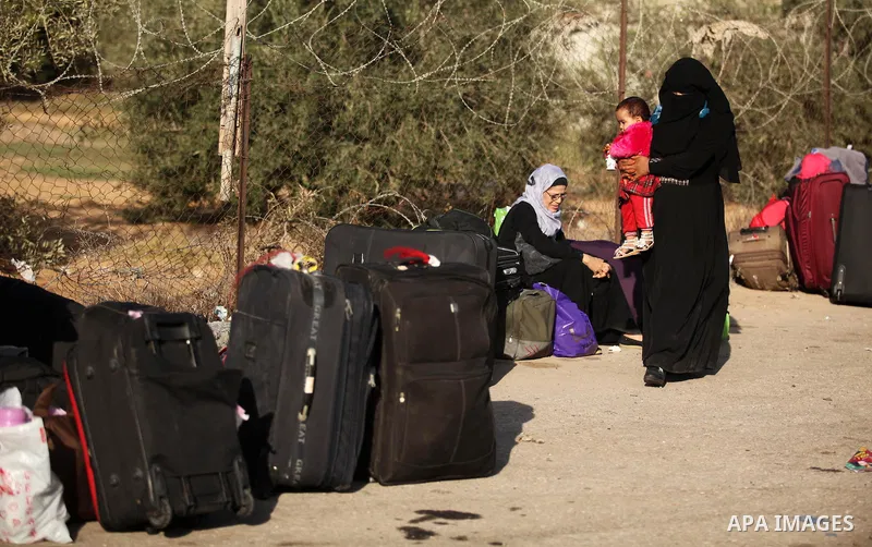 Palestinians wait for travel permits to cross into Egypt through the Rafah border crossing on October 15, 2016 in the southern Gaza Strip. Egyptian authorities temporarily reopened the crossing both directions for two da...