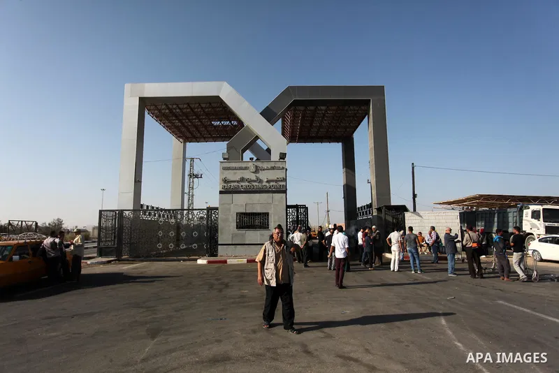 Palestinians wait for travel permits to cross into Egypt through the Rafah border crossing on October 15, 2016 in the southern Gaza Strip. Egyptian authorities temporarily reopened the crossing both directions for two da...