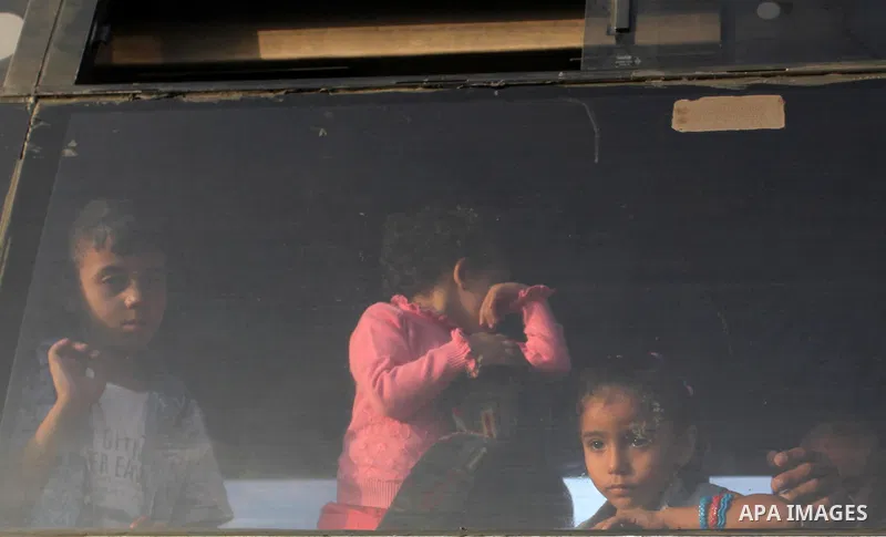 Palestinians wait for travel permits to cross into Egypt through the Rafah border crossing on October 15, 2016 in the southern Gaza Strip. Egyptian authorities temporarily reopened the crossing both directions for two da...