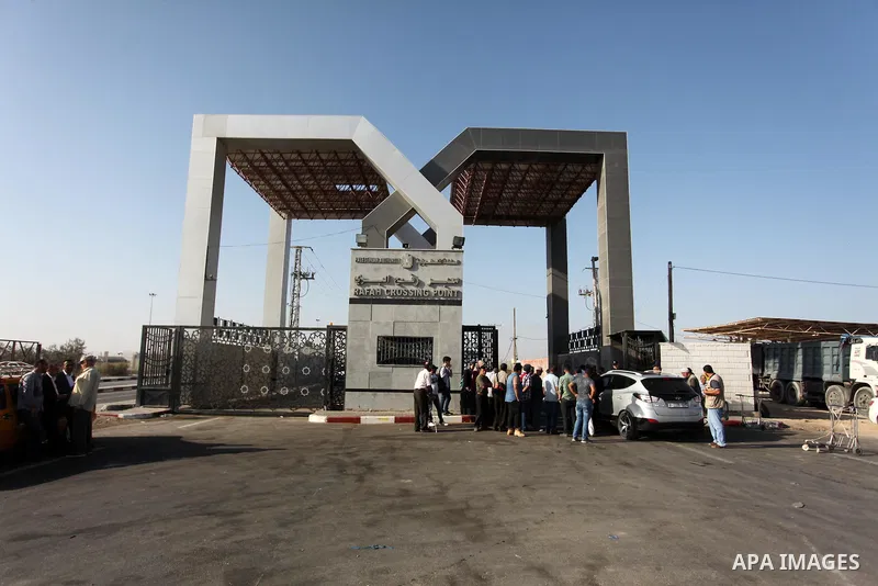 Palestinians wait for travel permits to cross into Egypt through the Rafah border crossing on October 15, 2016 in the southern Gaza Strip. Egyptian authorities temporarily reopened the crossing both directions for two da...