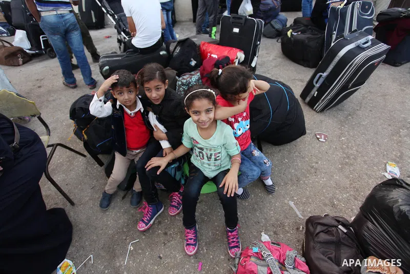 Palestinians wait for travel permits to cross into Egypt through the Rafah border crossing on October 15, 2016 in the southern Gaza Strip. Egyptian authorities temporarily reopened the crossing both directions for two da...