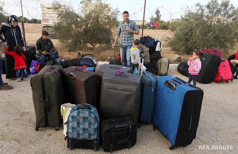 Palestinians wait for travel permits to cross into Egypt through the Rafah border crossing on October 15, 2016 in the southern Gaza Strip. Egyptian authorities temporarily reopened the crossing both directions for two da...