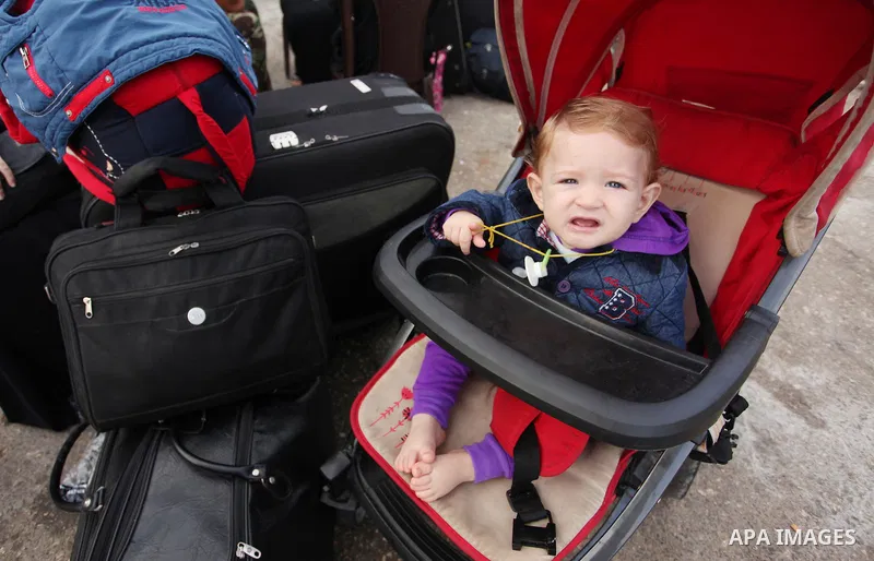 Palestinians wait for travel permits to cross into Egypt through the Rafah border crossing on October 15, 2016 in the southern Gaza Strip. Egyptian authorities temporarily reopened the crossing both directions for two da...