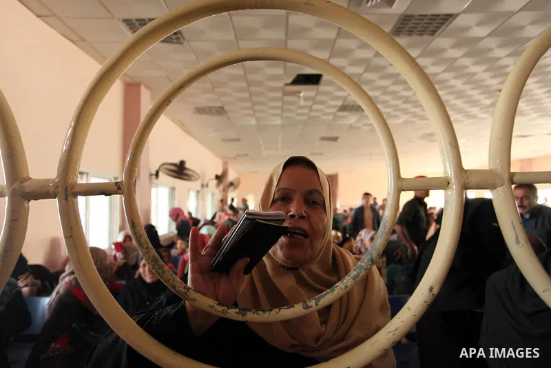 Palestinians wait for travel permits to cross into Egypt through the Rafah border crossing on October 15, 2016 in the southern Gaza Strip. Egyptian authorities temporarily reopened the crossing both directions for two da...