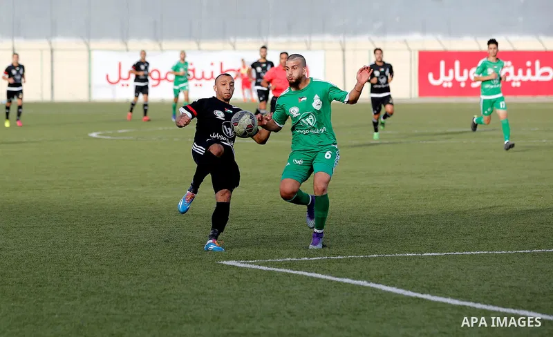 Shabab Hebron players and Ozlan south (Zahryah) players compete during the final match of the Palestinian Cup (Abu Ammar Cup), in the West Bank city of Hebron, on October 15, 2016. Photo by Wisam Hashlamoun