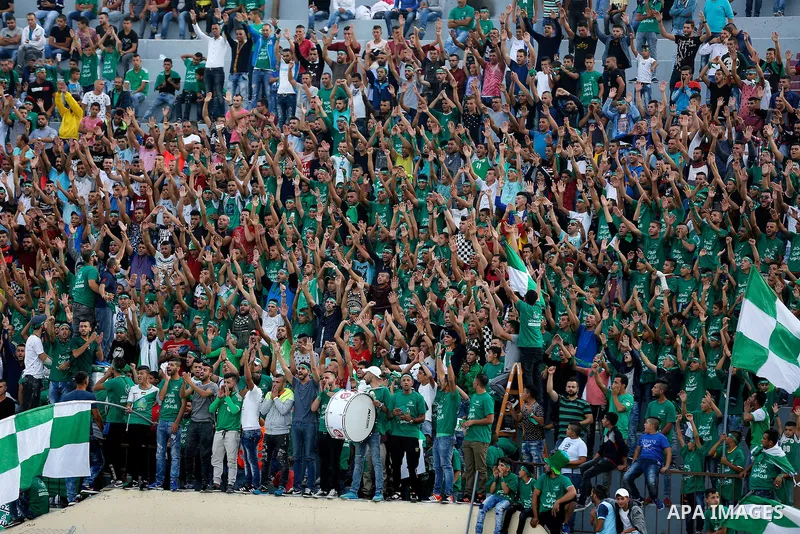 Fans attend the final match of the Palestinian Cup (Abu Ammar Cup) between Shabab Hebron players and Ozlan south (Zahryah) players, in the West Bank city of Hebron, on October 15, 2016. Photo by Wisam Hashlamoun