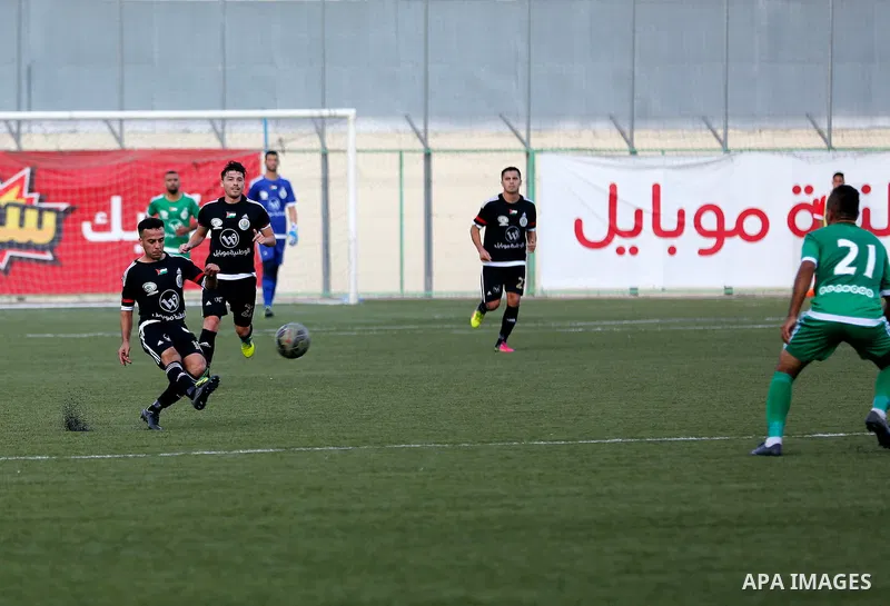 Shabab Hebron players and Ozlan south (Zahryah) players compete during the final match of the Palestinian Cup (Abu Ammar Cup), in the West Bank city of Hebron, on October 15, 2016. Photo by Wisam Hashlamoun