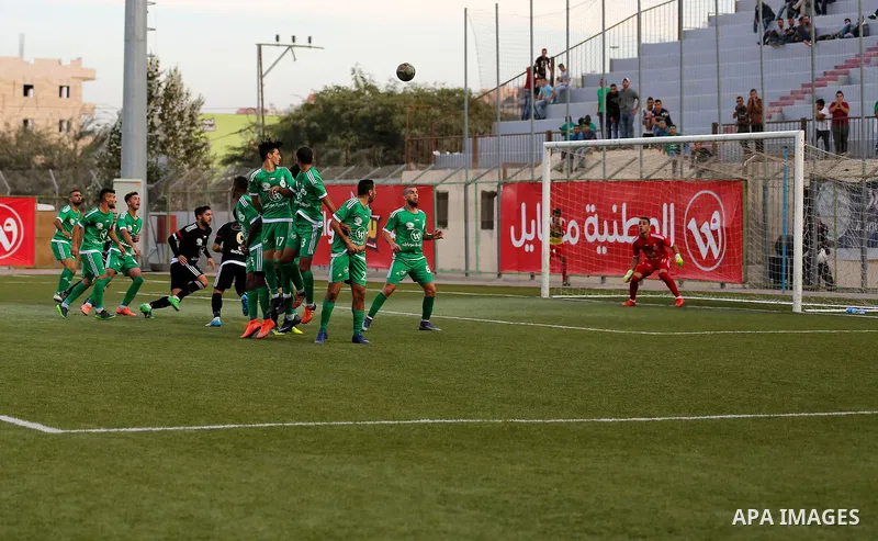 Shabab Hebron players and Ozlan south (Zahryah) players compete during the final match of the Palestinian Cup (Abu Ammar Cup), in the West Bank city of Hebron, on October 15, 2016. Photo by Wisam Hashlamoun