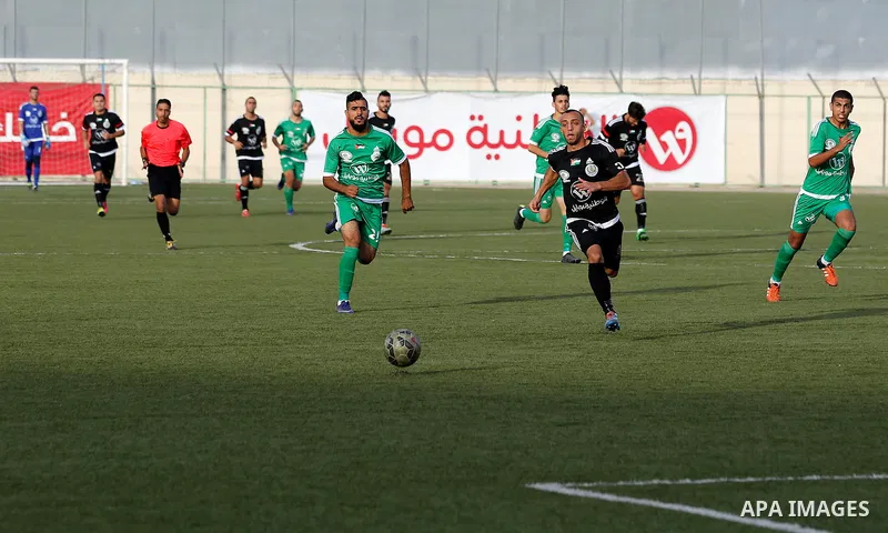 Shabab Hebron players and Ozlan south (Zahryah) players compete during the final match of the Palestinian Cup (Abu Ammar Cup), in the West Bank city of Hebron, on October 15, 2016. Photo by Wisam Hashlamoun