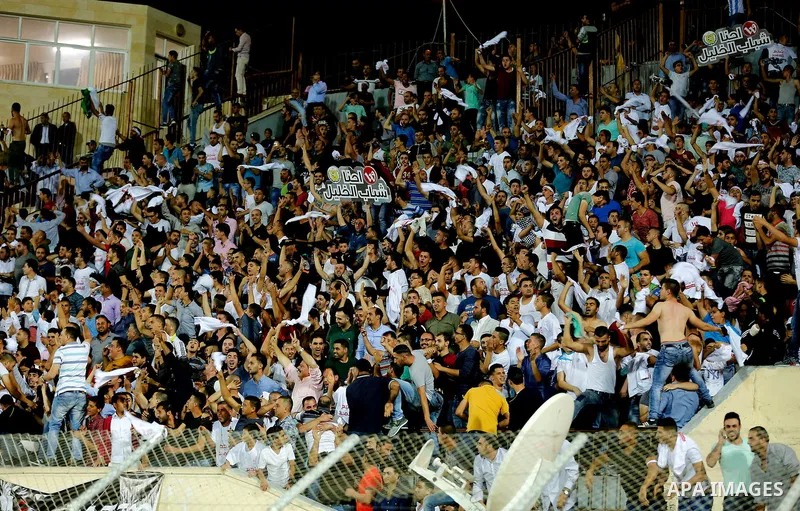 Fans attend the final match of the Palestinian Cup (Abu Ammar Cup) between Shabab Hebron players and Ozlan south (Zahryah) players, in the West Bank city of Hebron, on October 15, 2016. Photo by Wisam Hashlamoun