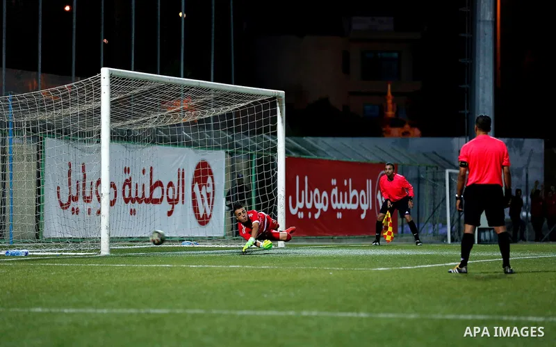 Shabab Hebron players and Ozlan south (Zahryah) players compete during the final match of the Palestinian Cup (Abu Ammar Cup), in the West Bank city of Hebron, on October 15, 2016. Photo by Wisam Hashlamoun